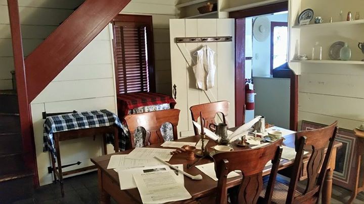 Historic writing room with table and quill at Weems-Botts Museum
